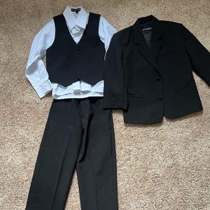 Flawless little boys suit. includes pants, white shirt, vest and jacket